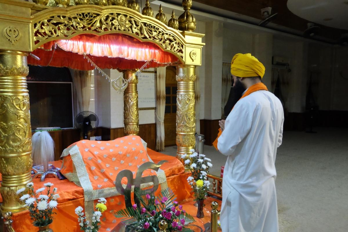 A ceremonial reader of the holy book in Sikhism at the end of a recital in a Sikh temple, or gurdwara, in Yangon.