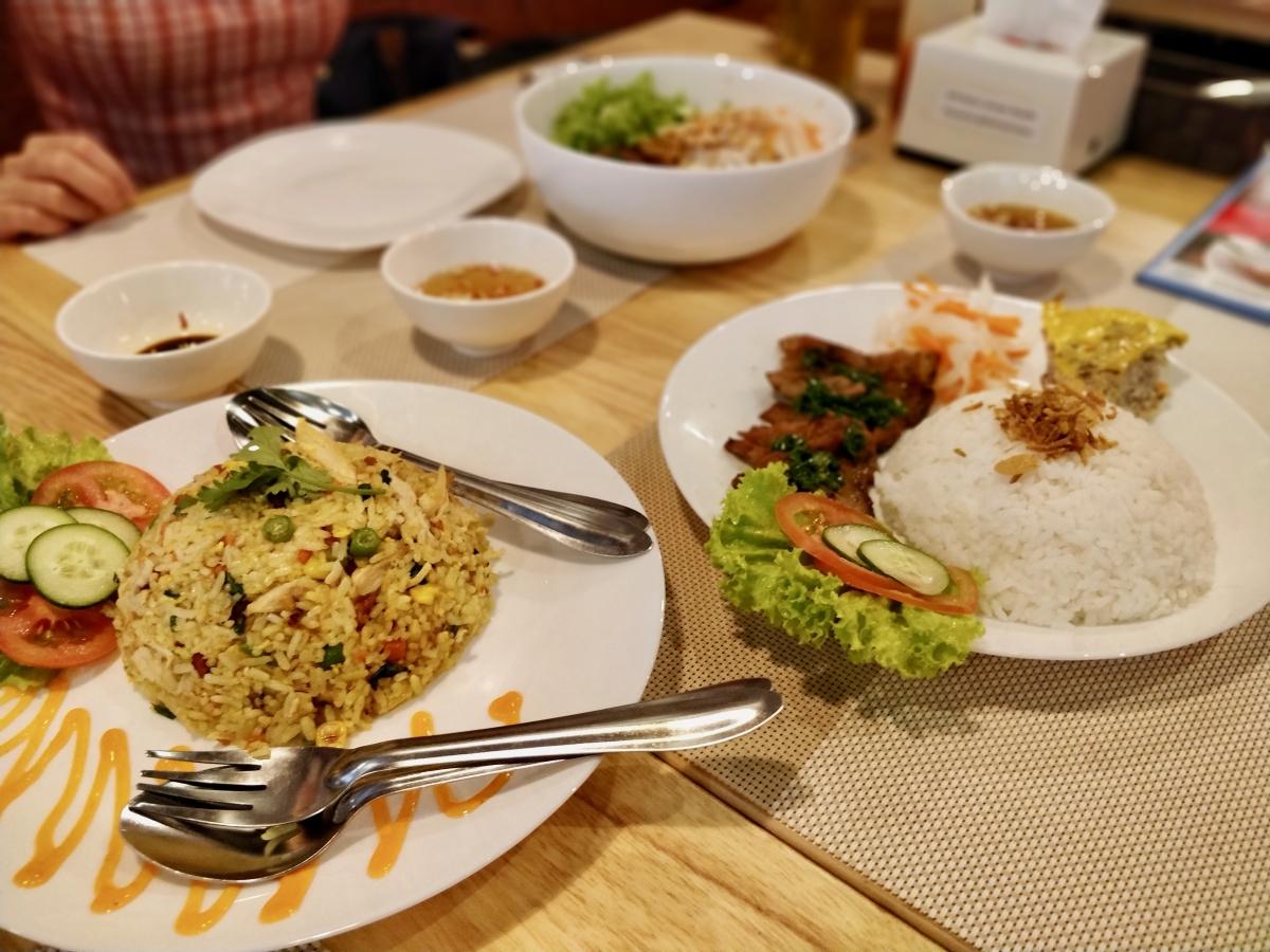 Fried chicken rice and com thit nuong (grilled pork with rice) at Annam Noodle Bar and Bites.