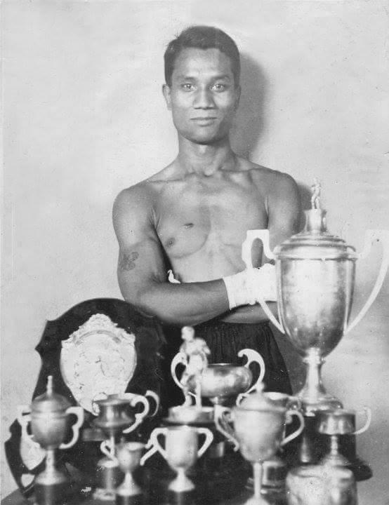 A young "Tiger" stands behind his trophies. (Kyar “Tiger” Ba Nyein / Facebook)
